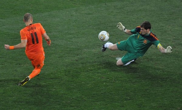 Spain’s goalkeeper Iker Casillas (R) pul